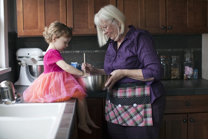 Grandmother And Granddaughter Baking Cookies