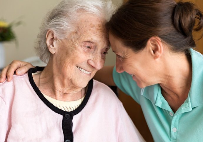 Dementia and Occupational Therapy - Home caregiver and senior adult woman